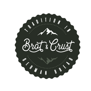 Black and white logo for 'Brot & Crust' with mountain design on a white background
