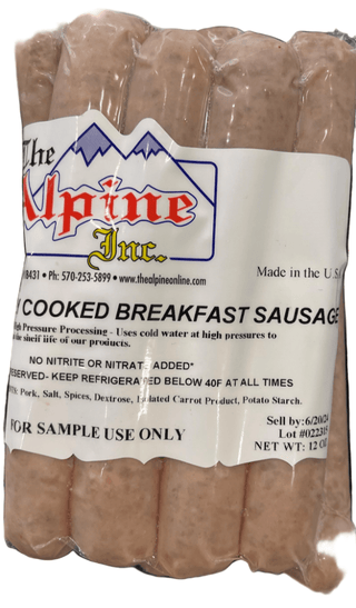 Package of Alpine Inc. cooked breakfast sausages on a marble surface