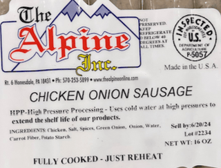 Packaged chicken onion sausage from The Alpine Inc. on a marble surface