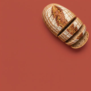 Loaf of bread sliced on a red background