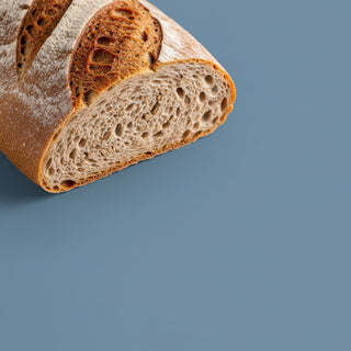 Sliced loaf of bread on a blue background