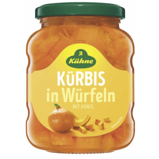 Jar of Küßeöne pumpkin cubes with honey on a white background