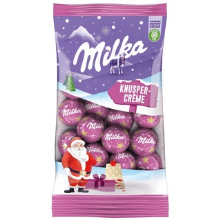 Milka chocolate package with festive design featuring Santa Claus and snow scene.