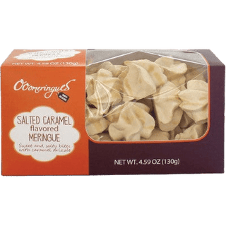 Salted caramel flavored meringue cookies on a white plate.