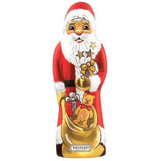 Chocolate figure of Santa Claus with a sack, gift, and teddy bear on a white background
