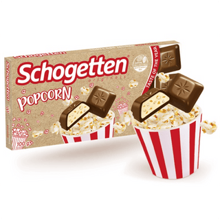 Schogetten Popcorn chocolate packaging with popcorn and chocolate pieces on a white background