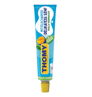 A tube of Thomy medium hot mustard. The packaging is predominantly yellow and blue, with the Thomy logo prominently displayed.
